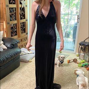 Long black prom dress back has sheer  black triangle from legs down to floor